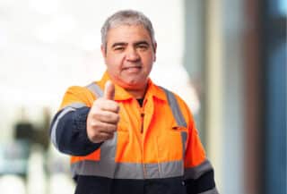 portrait of a outdoor worker doing an okay symbol