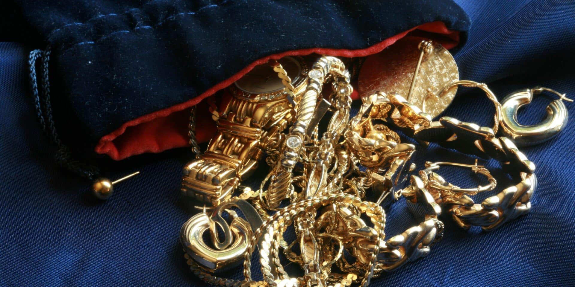 Old,Gold,Jewelry,On,Blue,Silk