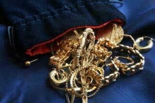 Old,Gold,Jewelry,On,Blue,Silk