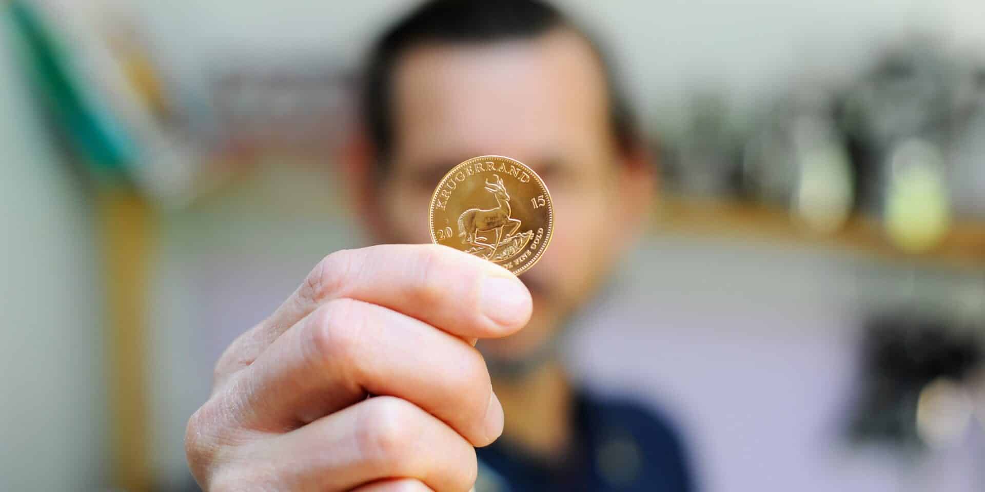 Caucasian,Man,Is,Holding,Krugerrand,Gold,Coin,Close,Up,In