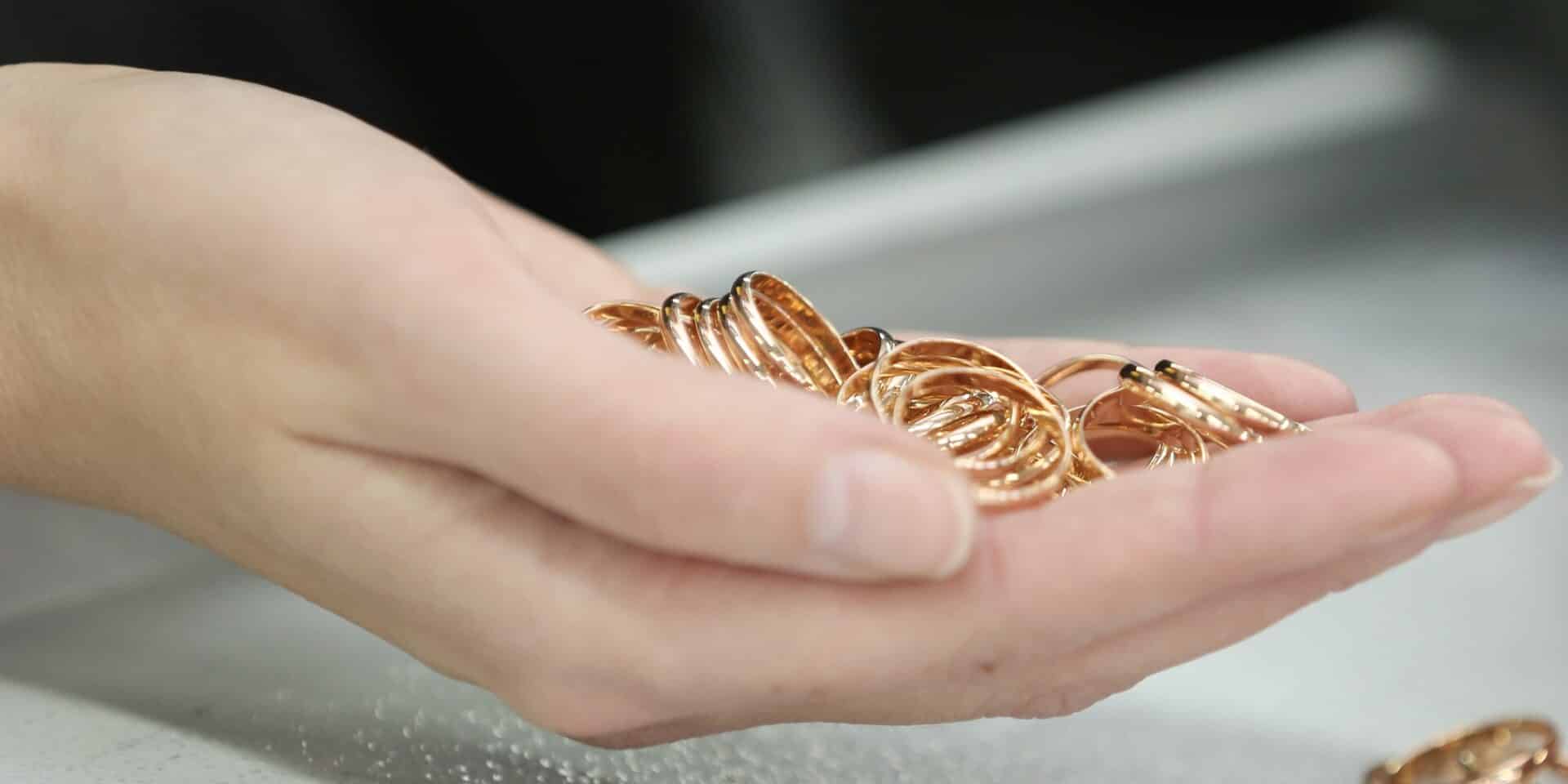 A,Lot,Of,Gold,Rings,On,The,Girl’s,Palm