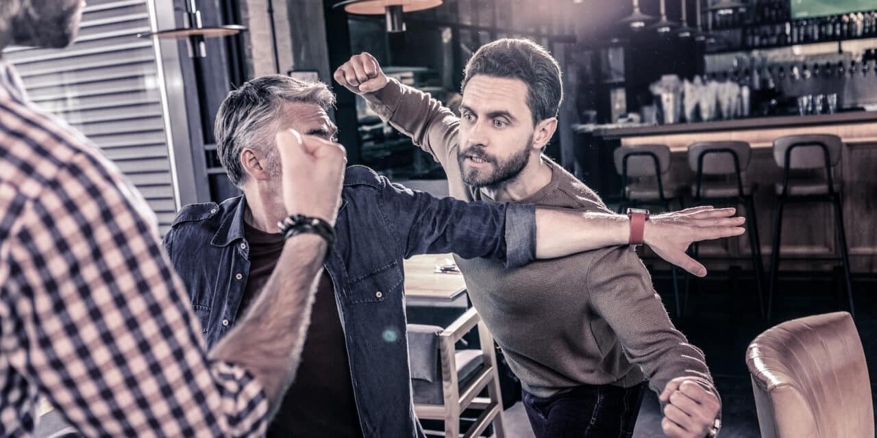 Angry bearded man going to beat his friend