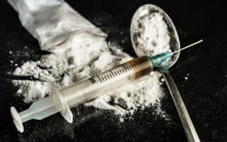 bigstock-Drug-Syringe-And-Cooked-Heroin-76081889