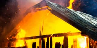 wooden-house-barn-burning-fire-night_127089-9232