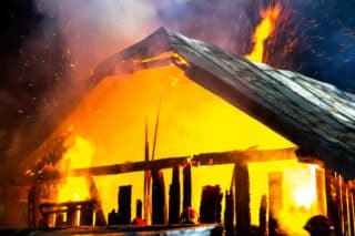 wooden-house-barn-burning-fire-night_127089-9232