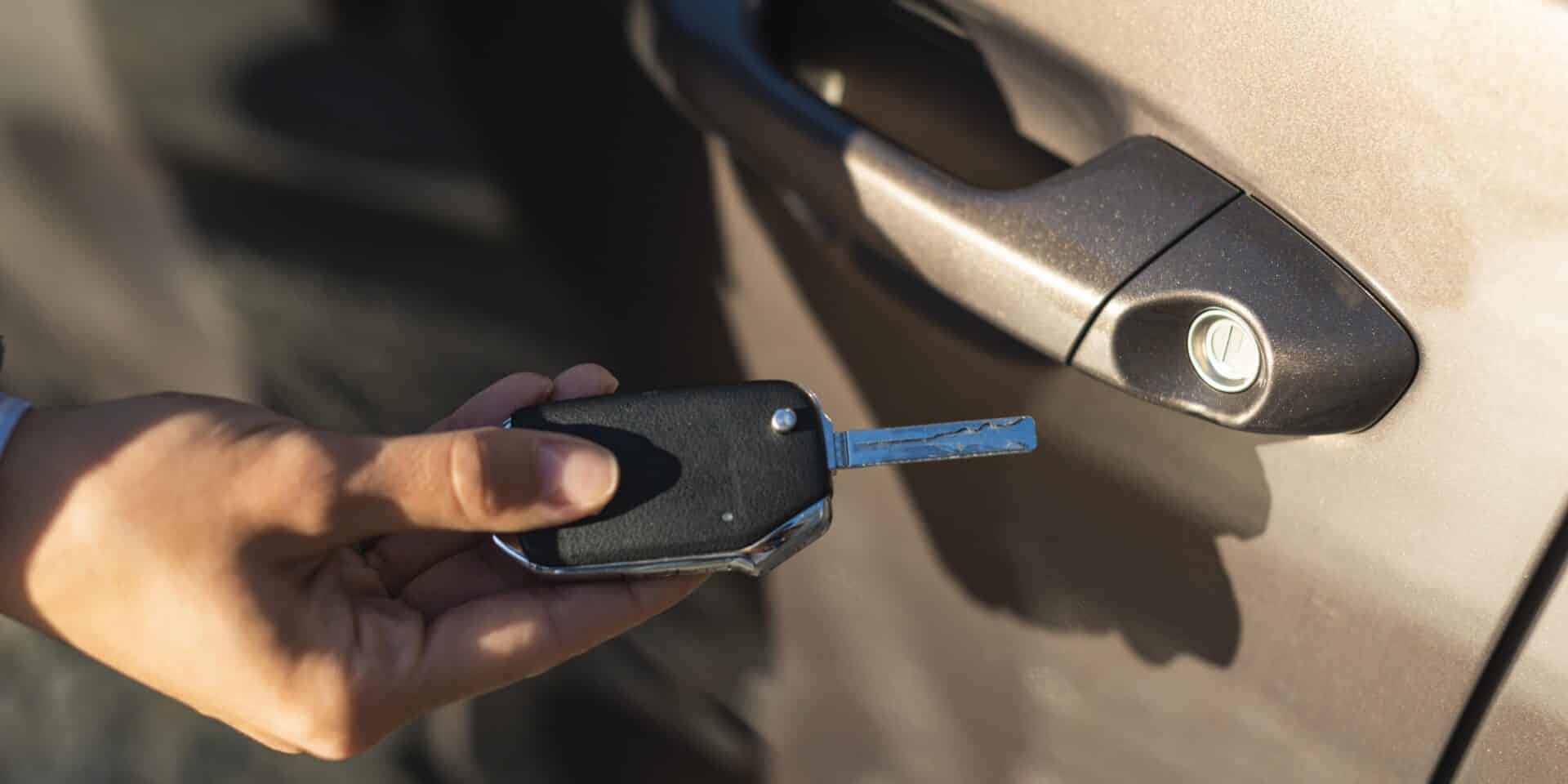 businesswoman-using-key-unlock-her-car-door