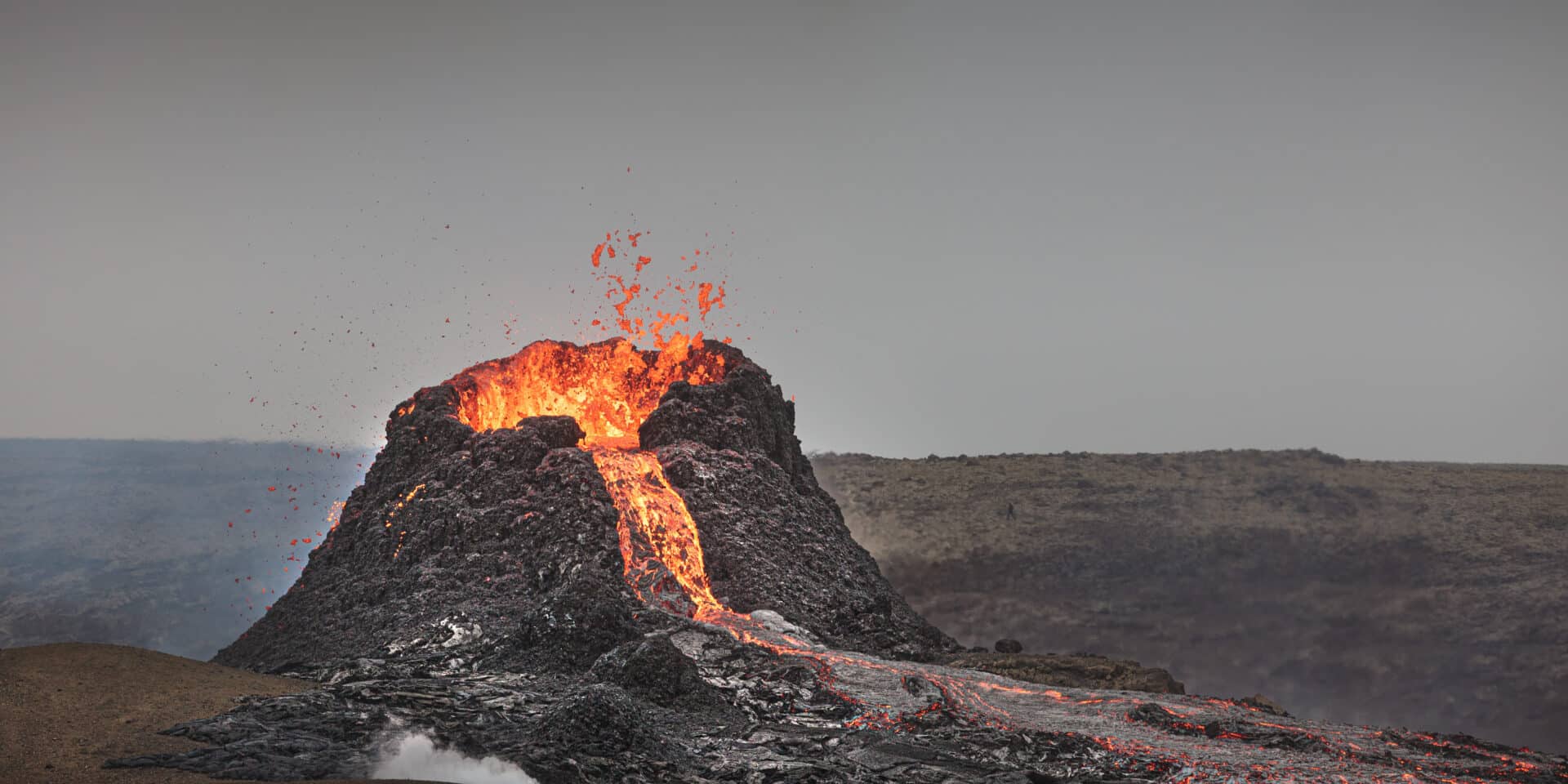 beautiful-shot-active-volcano-with-flowing-lava-smoke-clear-sky