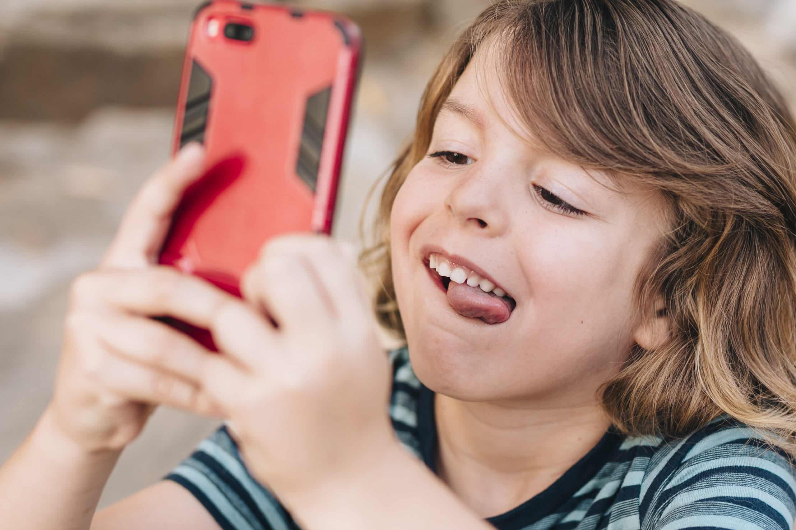 close-up-kid-playing-phone