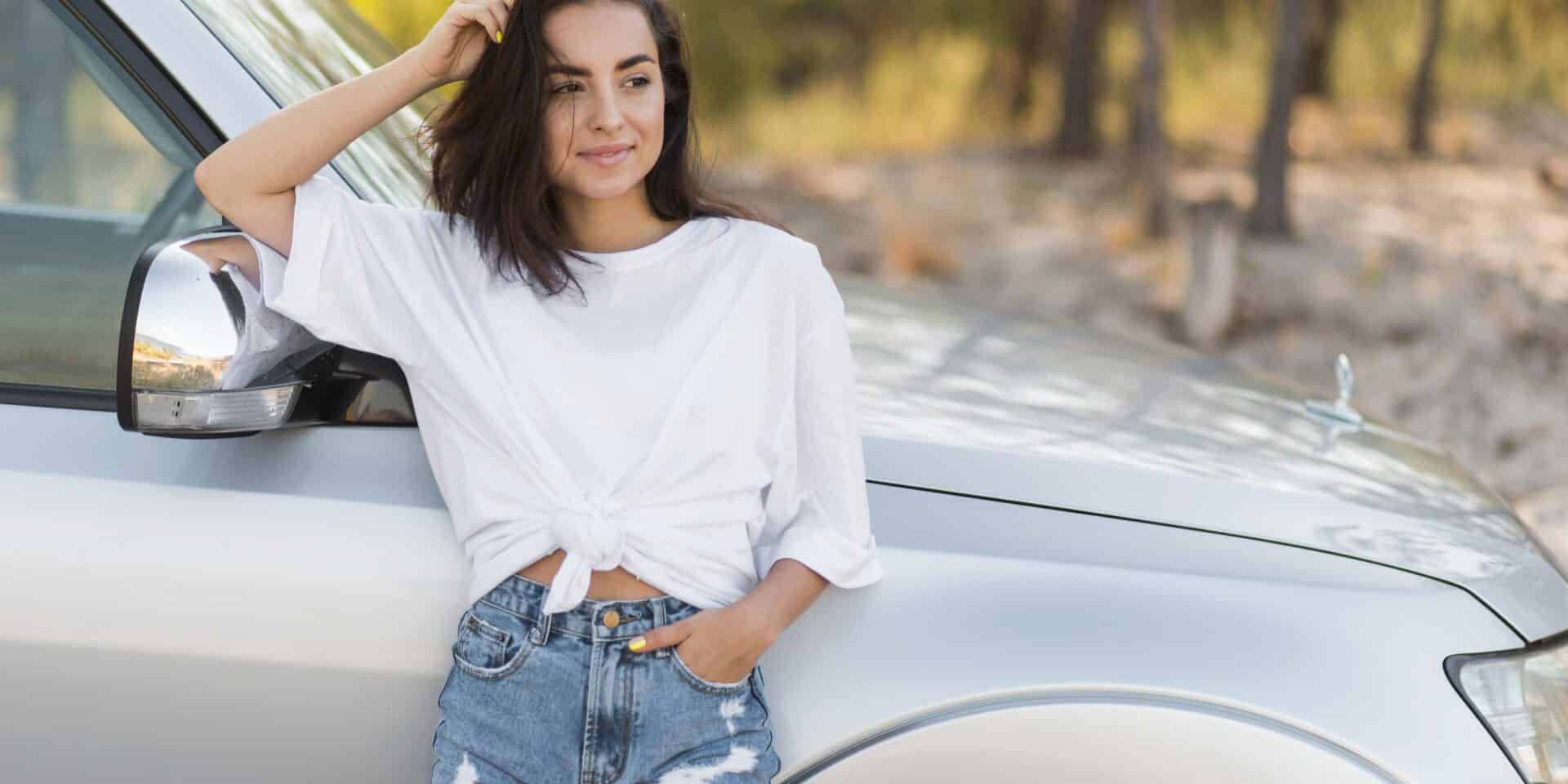 smiley-woman-posing-near-car