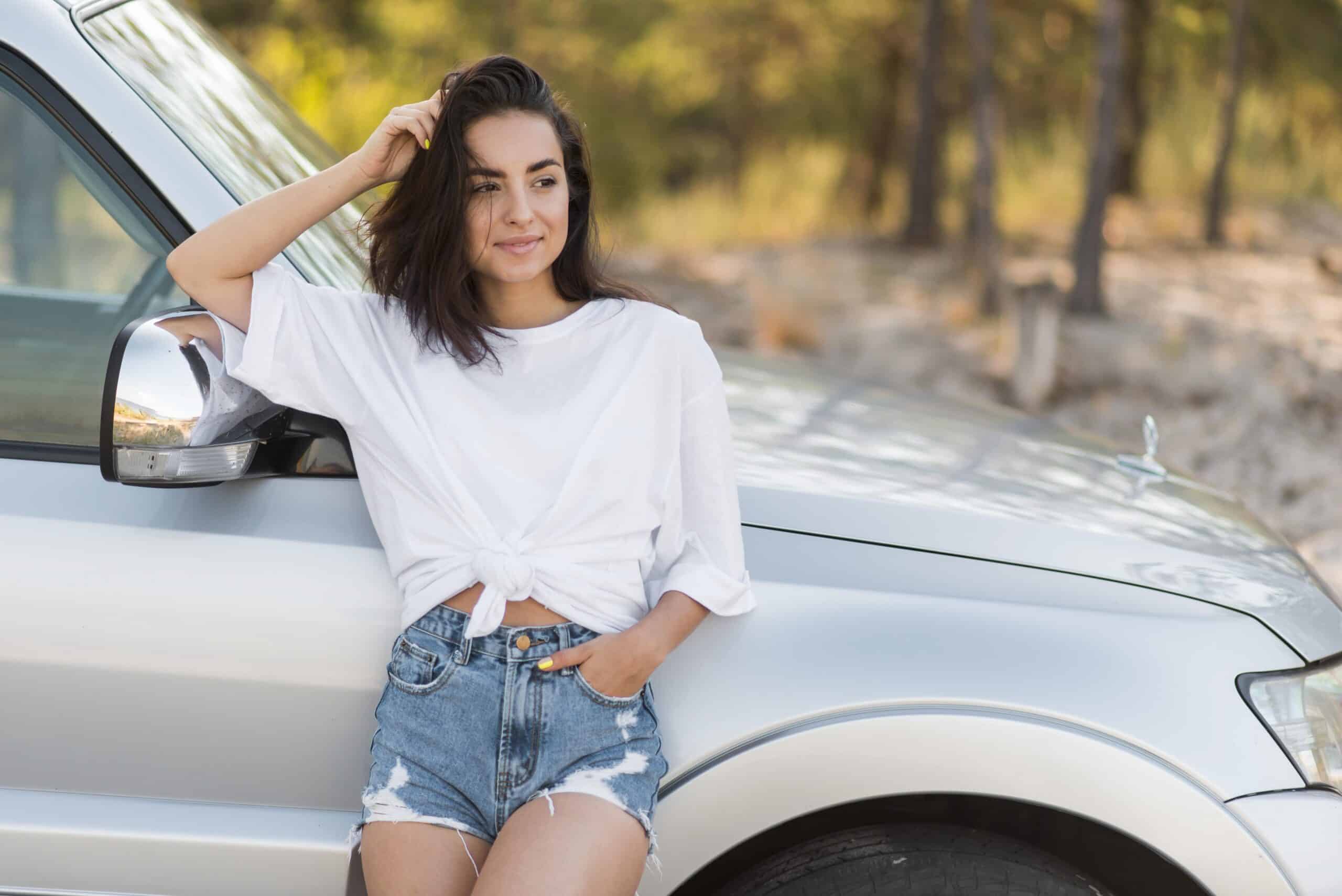 smiley-woman-posing-near-car
