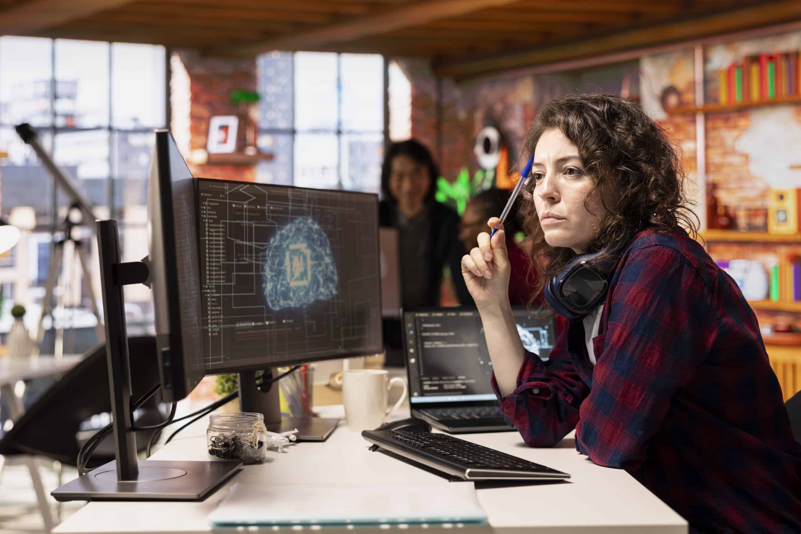 Woman working in AI tech agency providing custom software development services