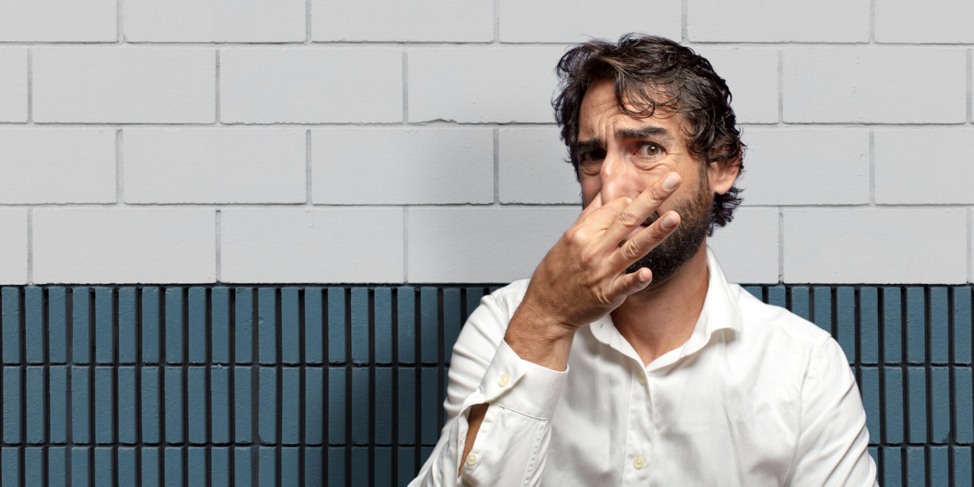 feeling disgusted, holding nose to avoid smelling a foul and unpleasant stench