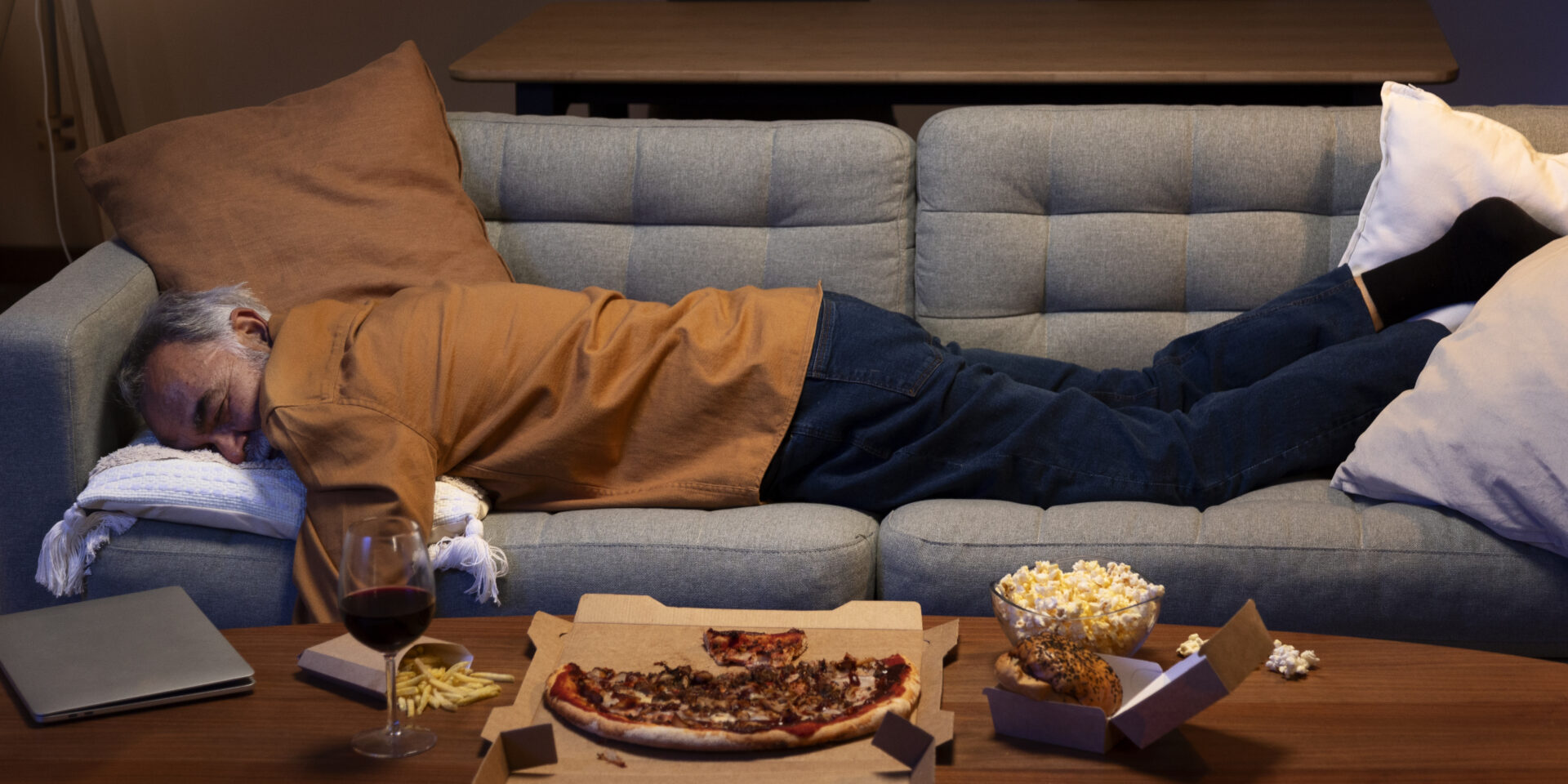 man-sleeping-couch-home-after-earing-take-out