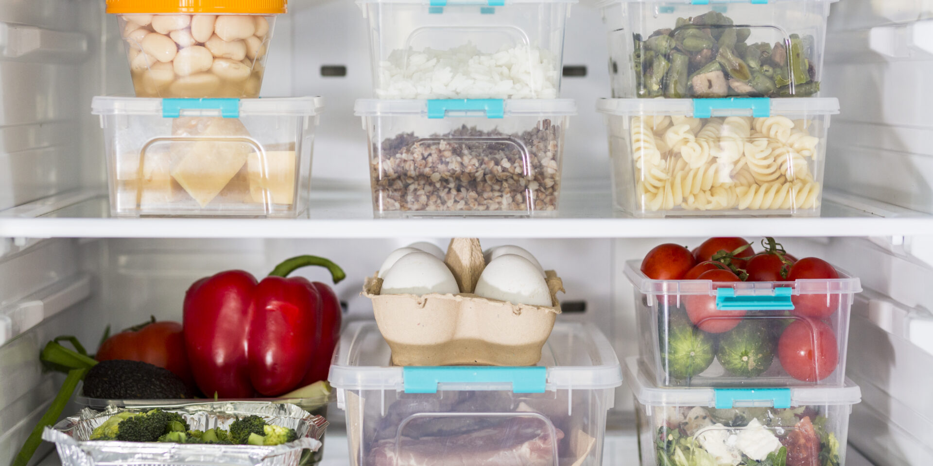 open-fridge-with-plastic-food-containers-vegetables