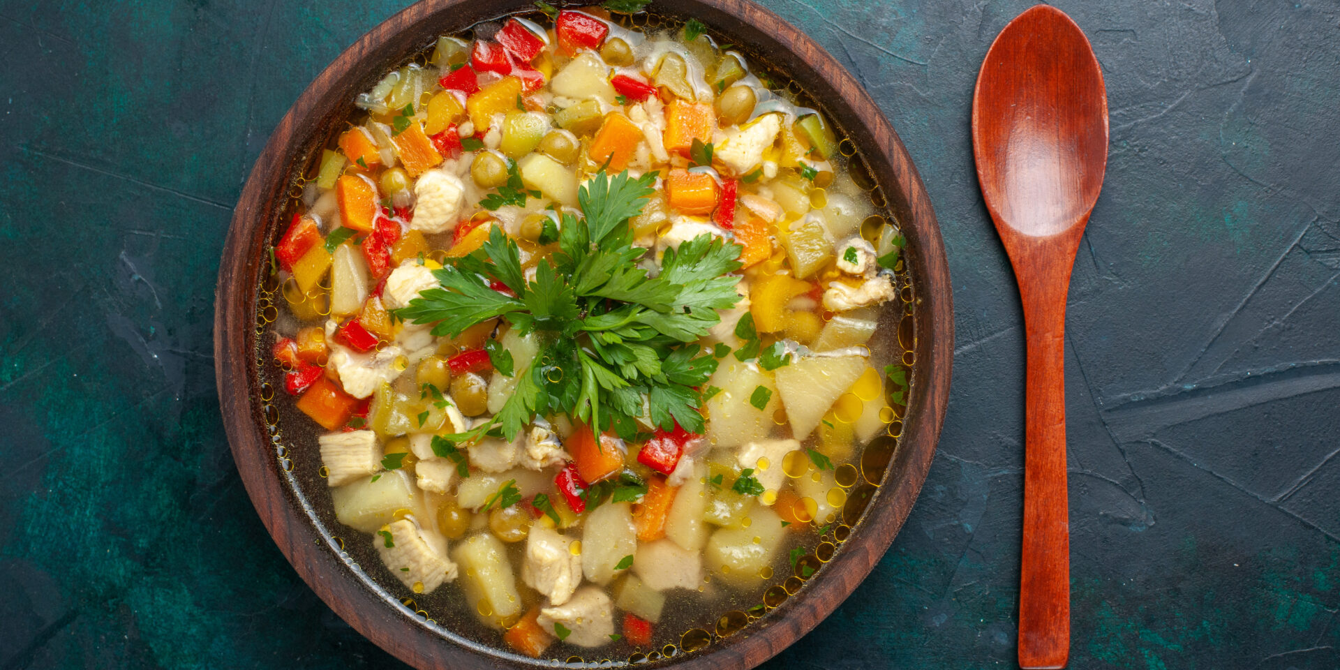 top-view-delicious-vegetable-soup-with-different-ingredients-inside-brown-plate-dark-desk-soup-vegetables-sauce-meal-food-hot-food