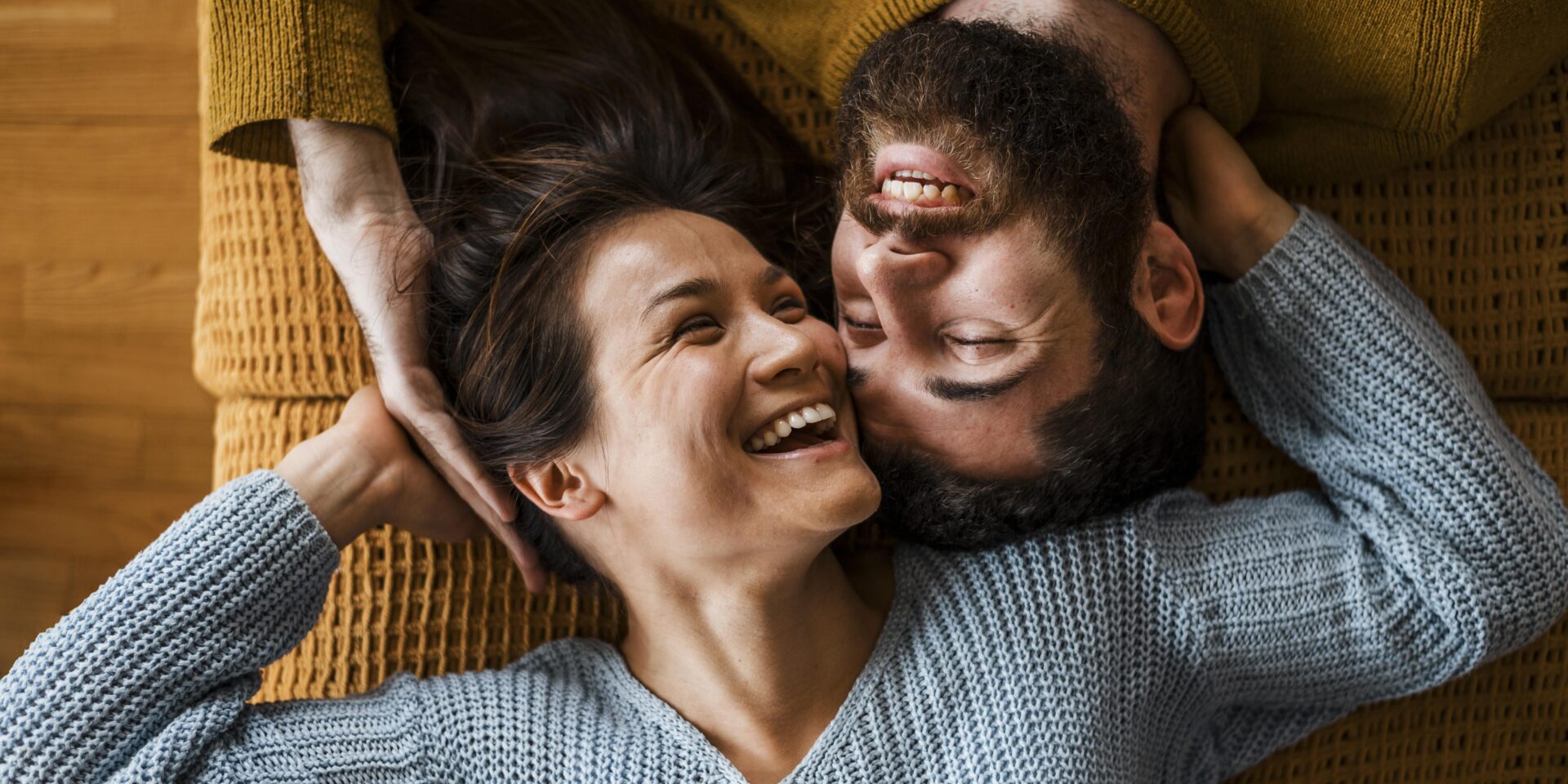 top-view-happy-couple-laying-together