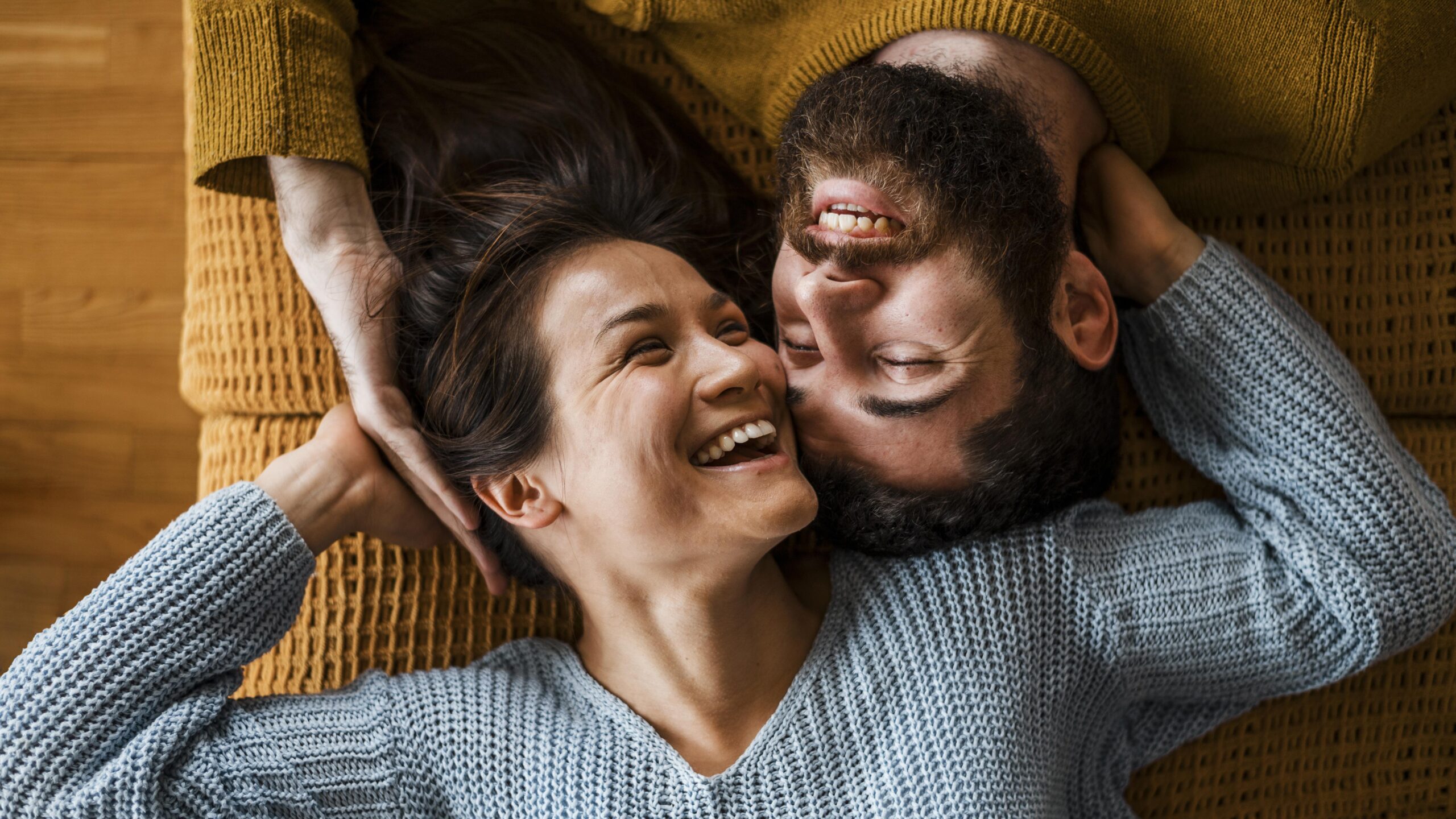 top-view-happy-couple-laying-together