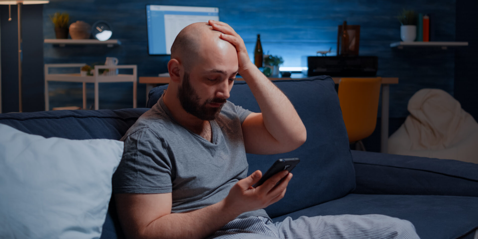 Astonished man by warning notification for unpaid bank bills