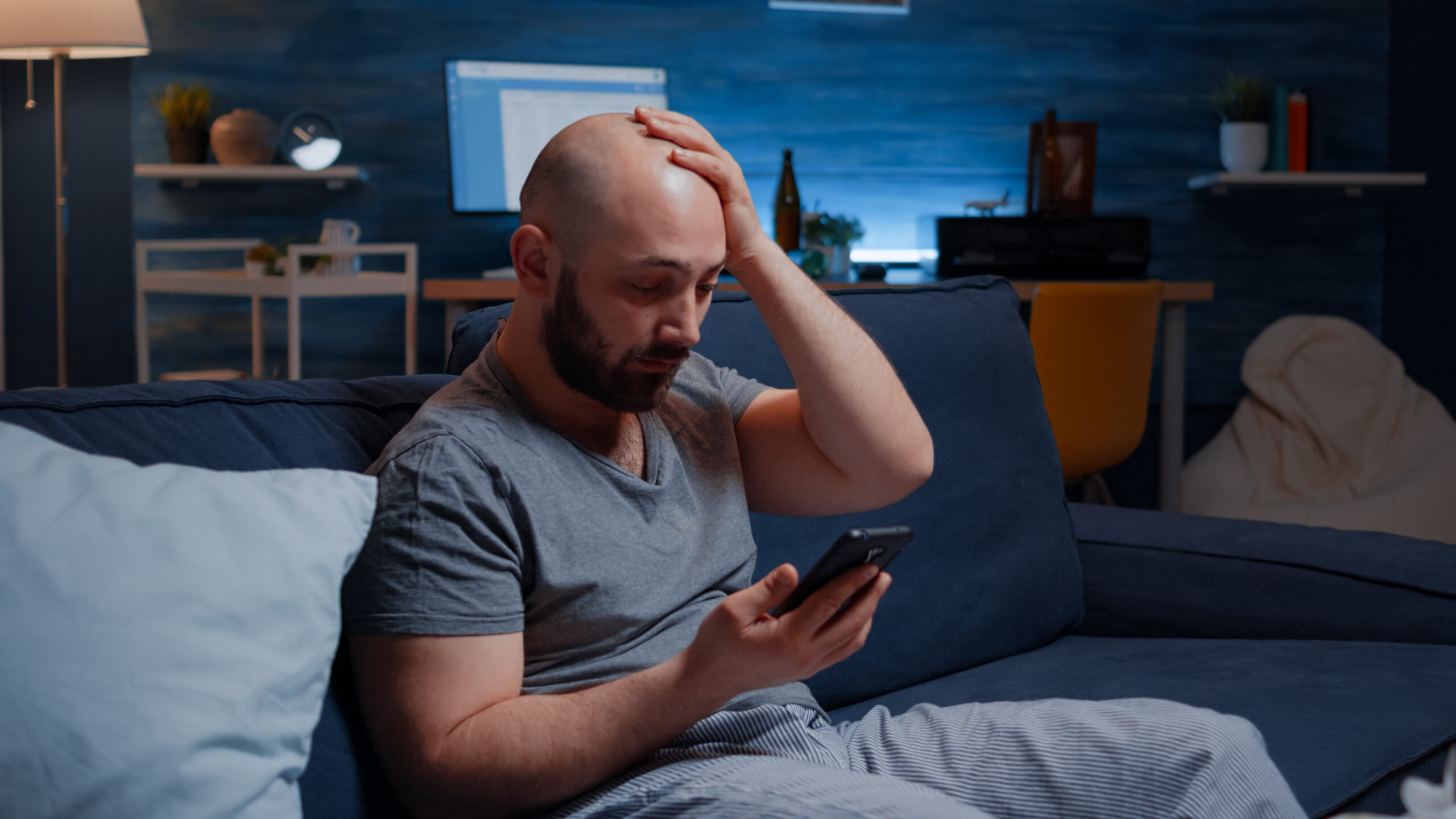 Astonished man by warning notification for unpaid bank bills