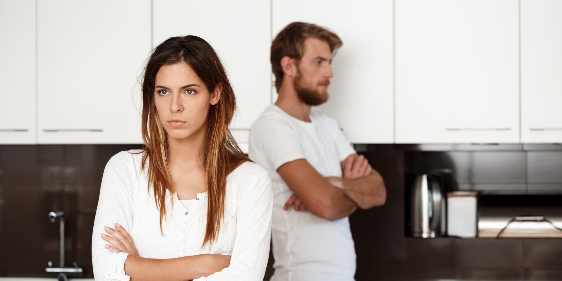 Displeased beautiful brunette girl in quarrel with her boyfriend background.