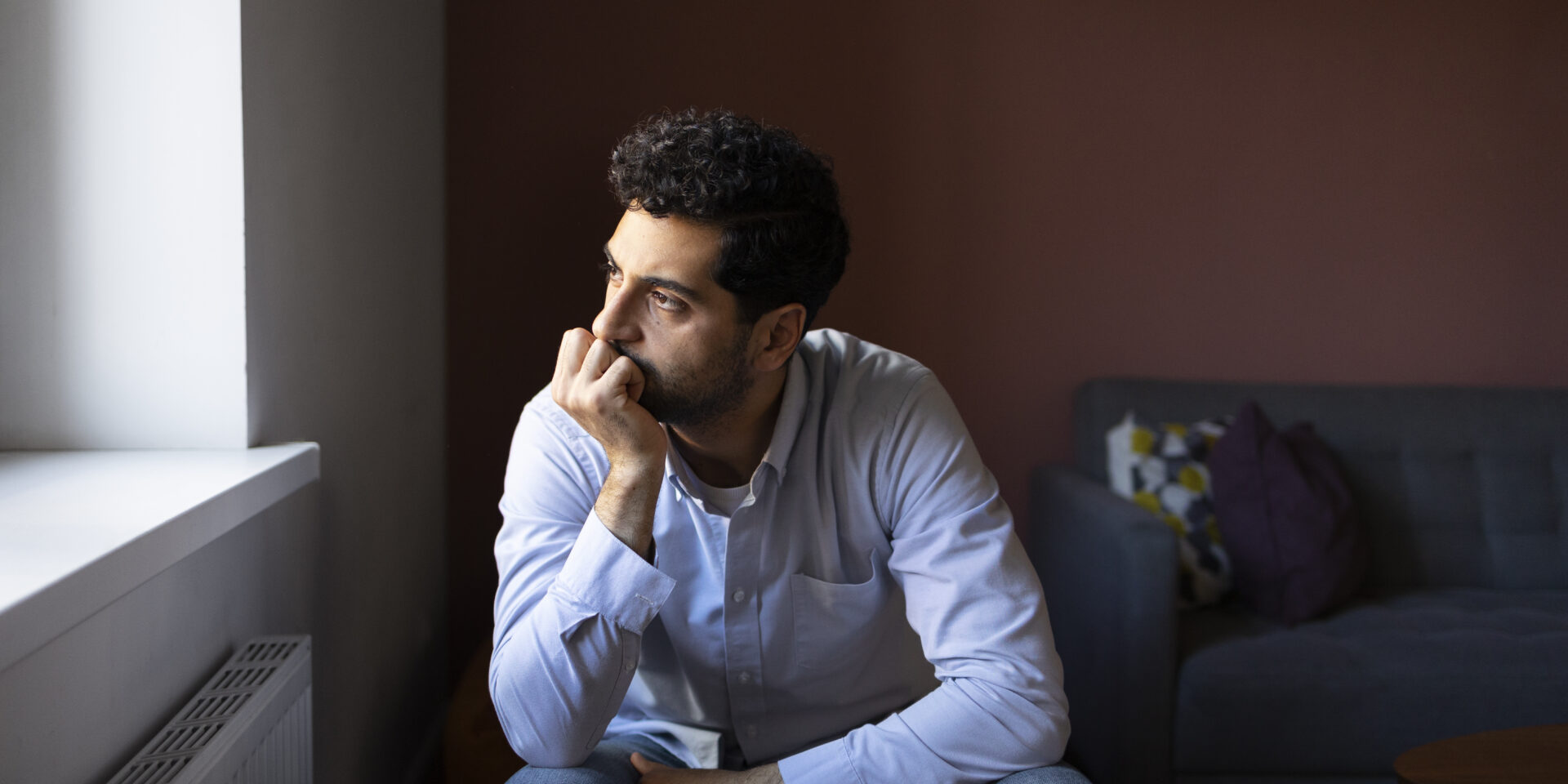 anxious-man-indoors-front-view