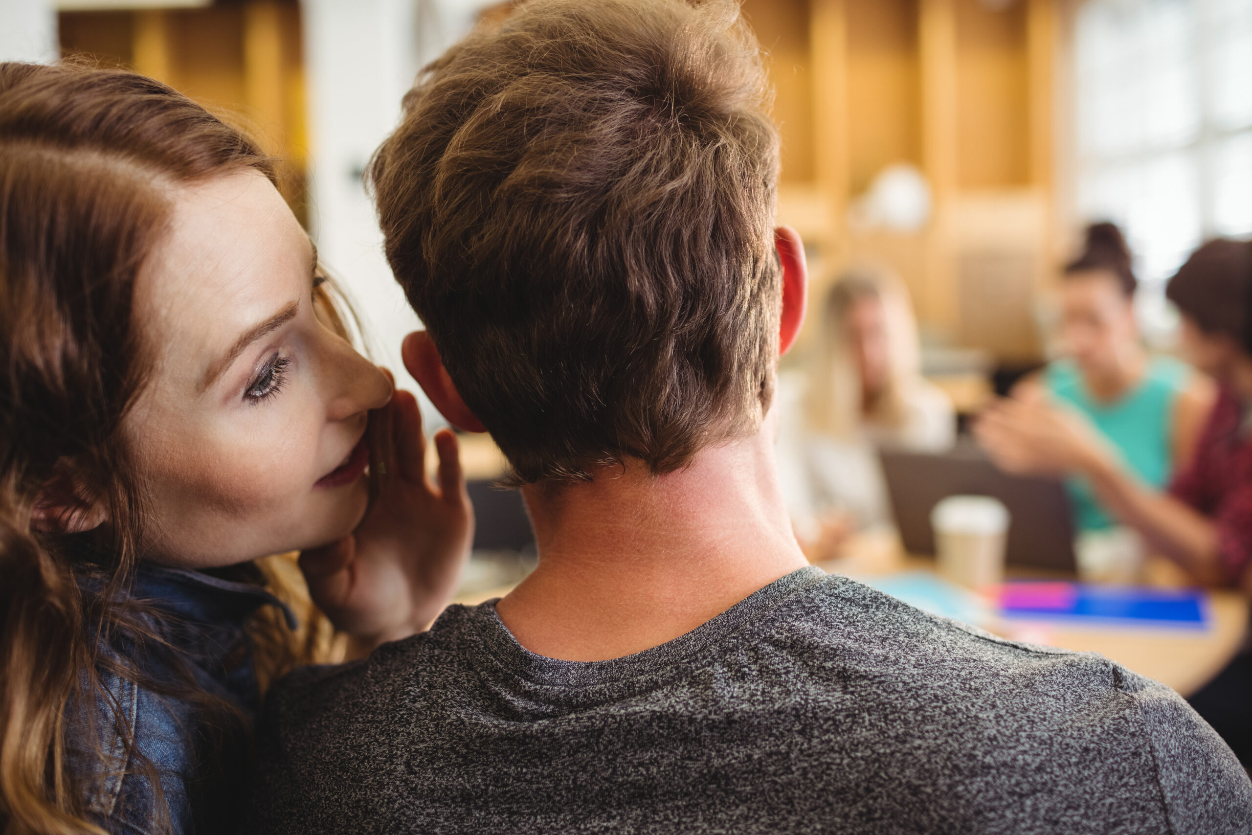Close-up of business executives gossiping together
