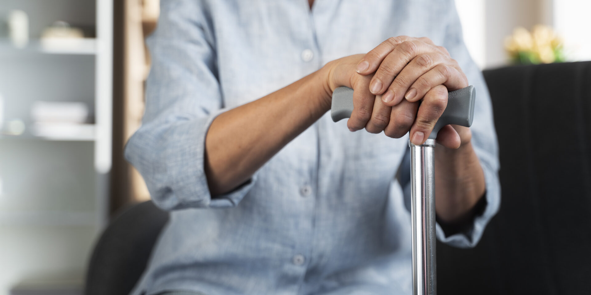 close-up-hands-holding-cane