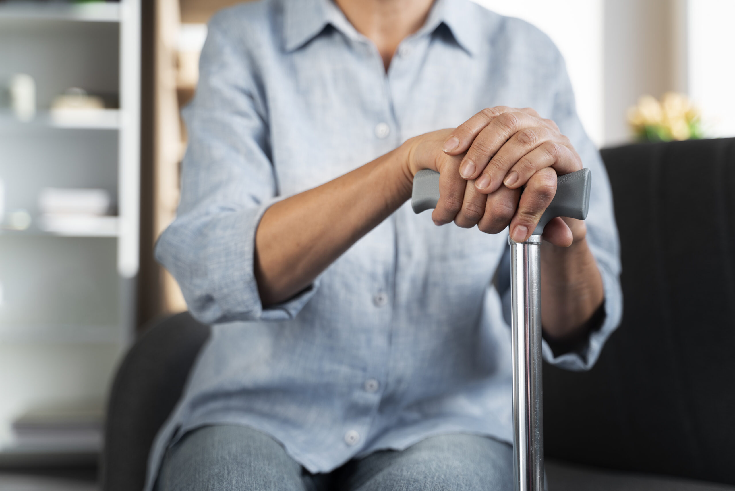 close-up-hands-holding-cane