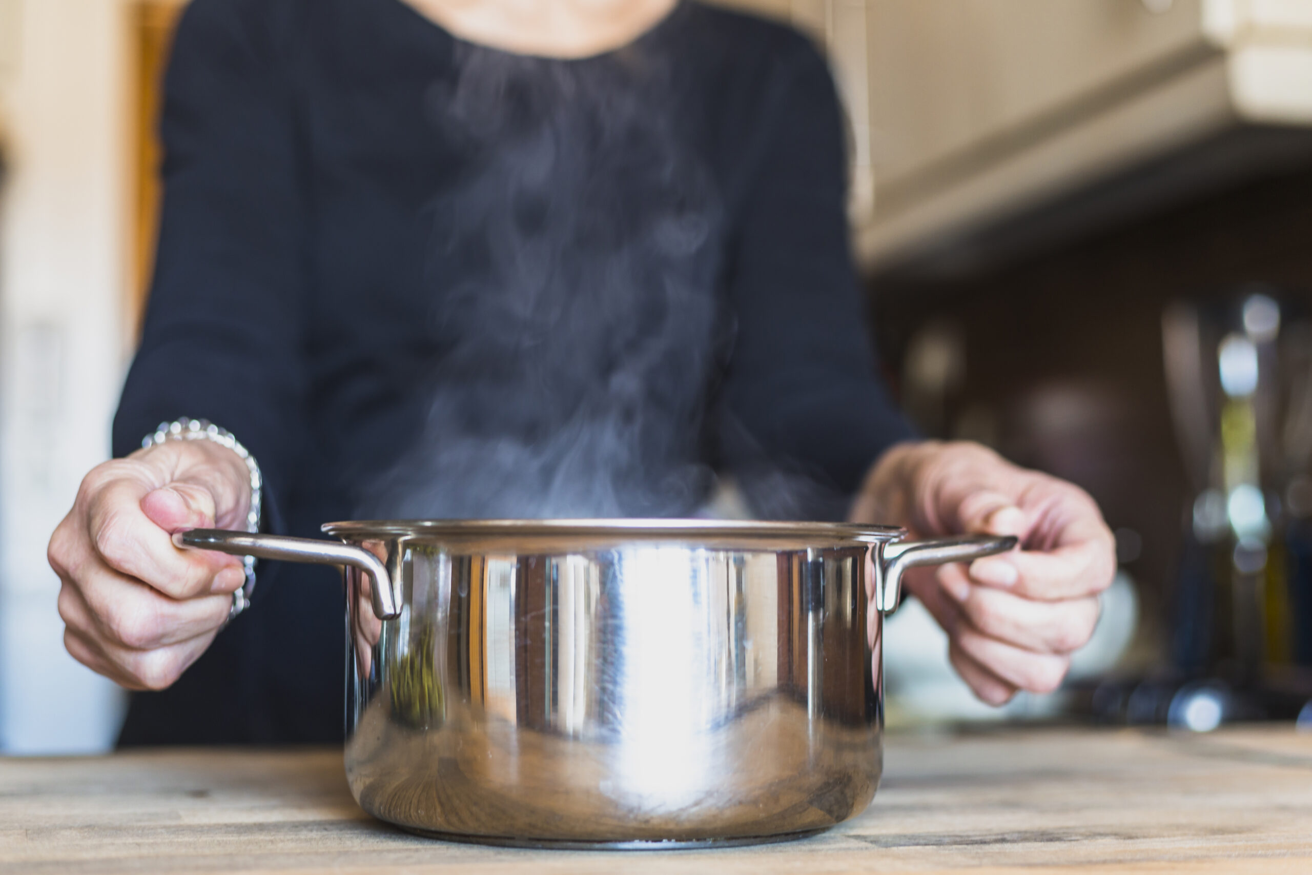 crop-hands-woman-cooking-dish-kitchen