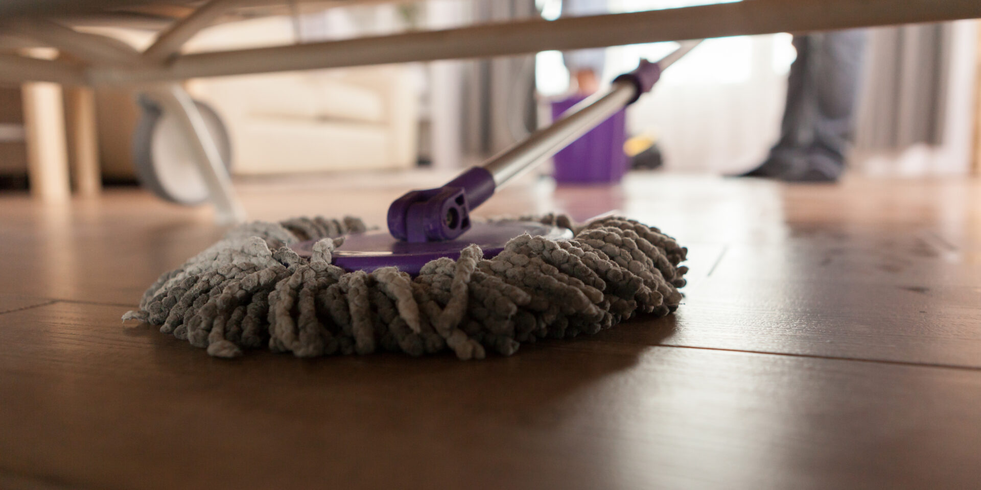 Mopping under sofa