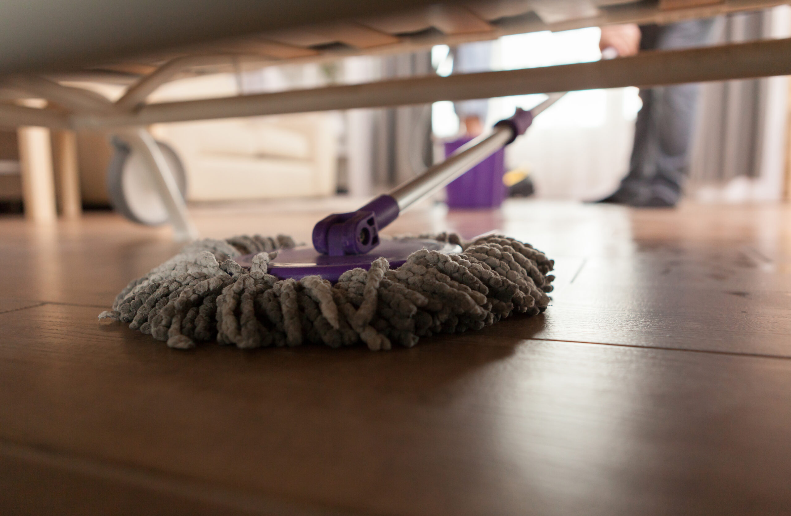Mopping under sofa