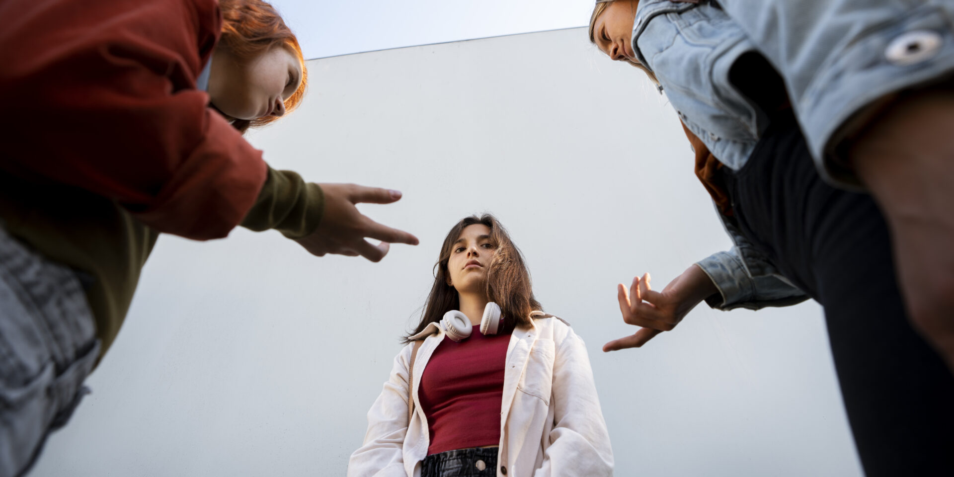 low-angle-girls-arguing-outdoors