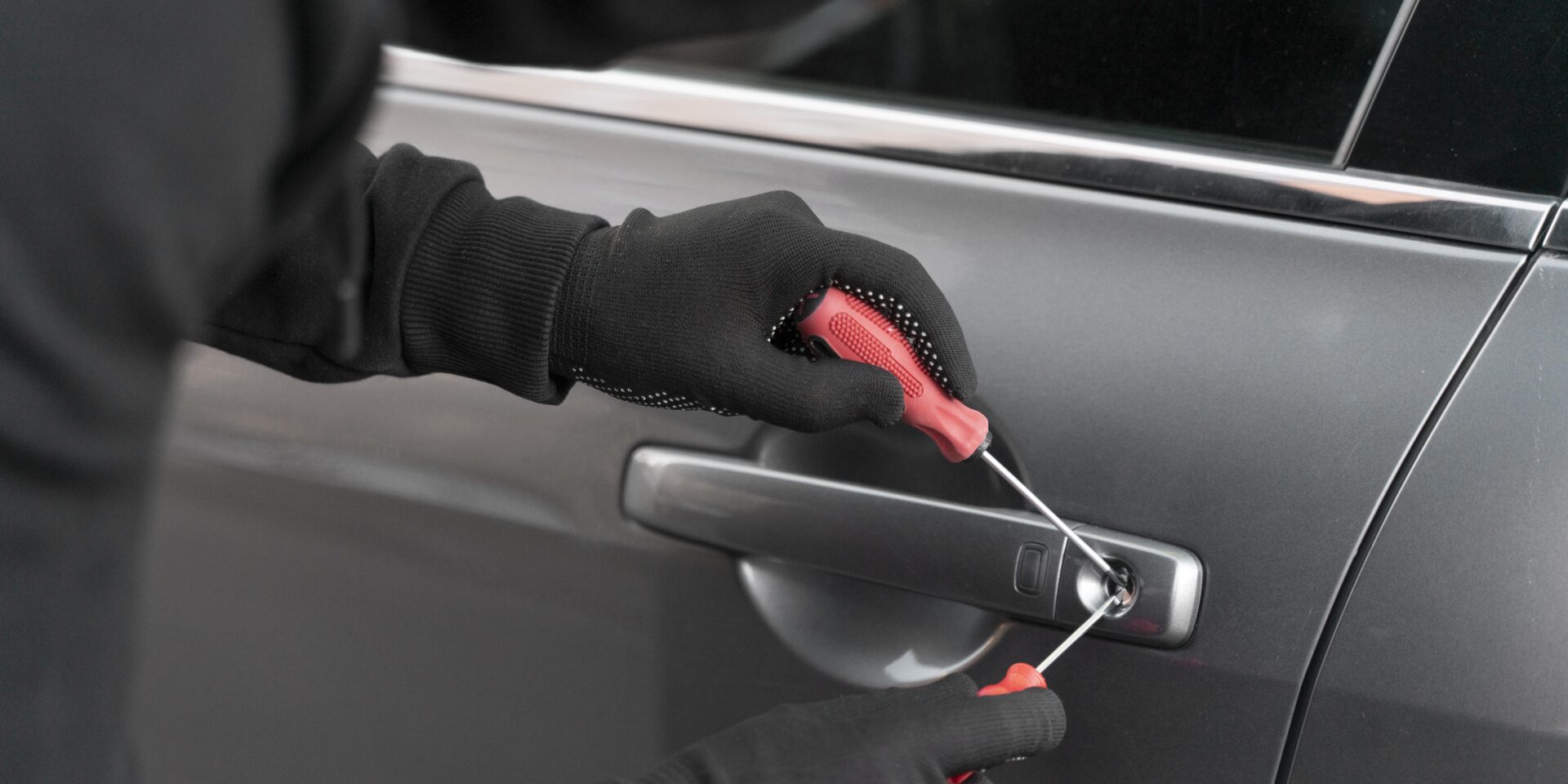 close-up-man-trying-break-into-car