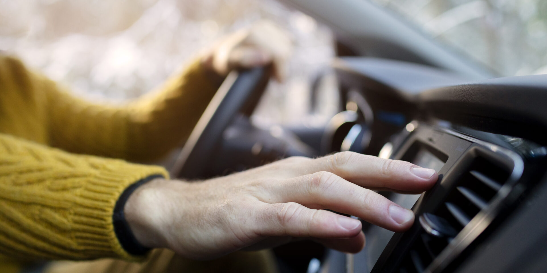 close-up-hand-holding-steering-wheel