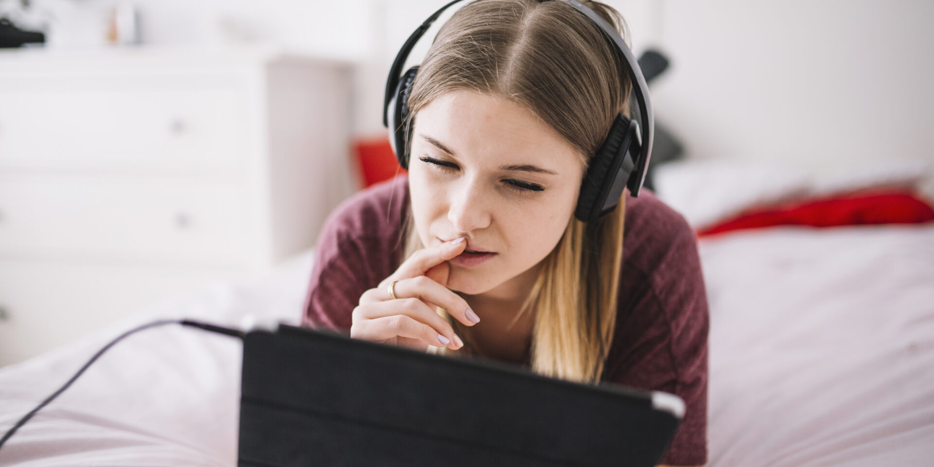 woman-listening-music-browsing-tablet
