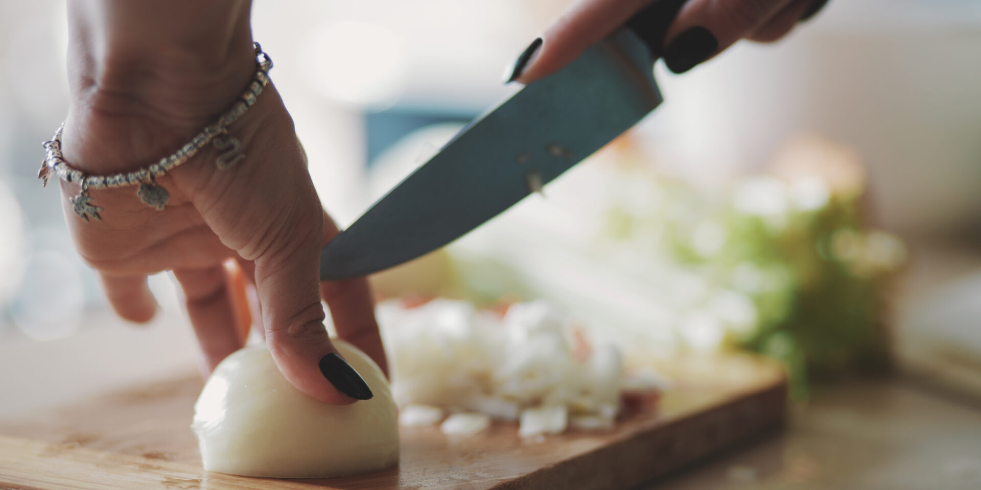 Young woman cutting vegetables