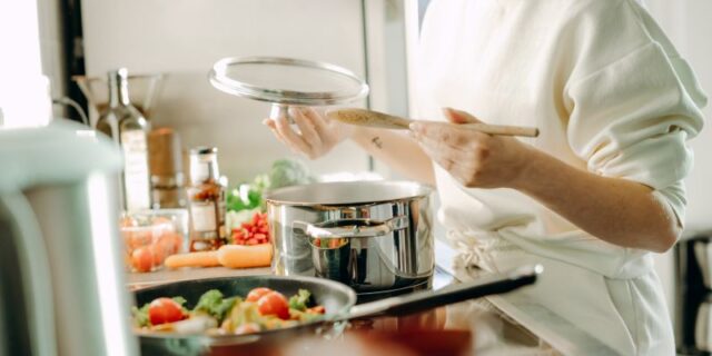 Girl cooking at the kitchen healthy food